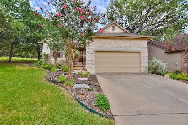 view of front of home with a front yard and a garage