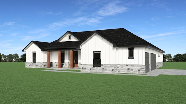 rear view of property featuring covered porch, a garage, and a yard