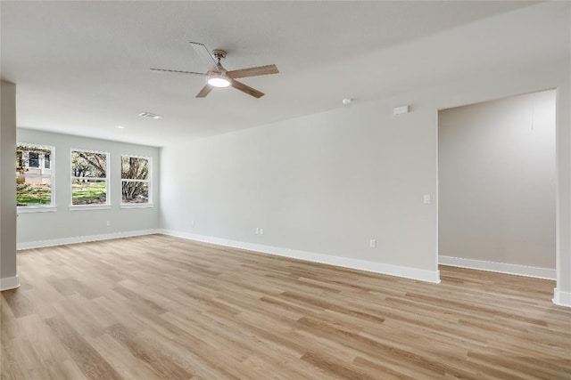 unfurnished room featuring ceiling fan and light wood-type flooring