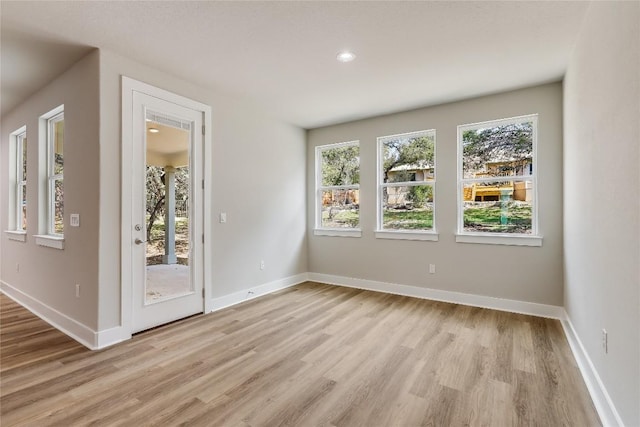 spare room featuring light wood-type flooring