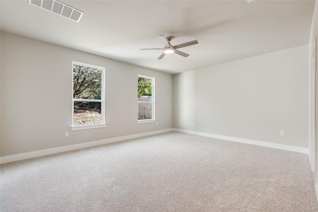 empty room featuring carpet and ceiling fan