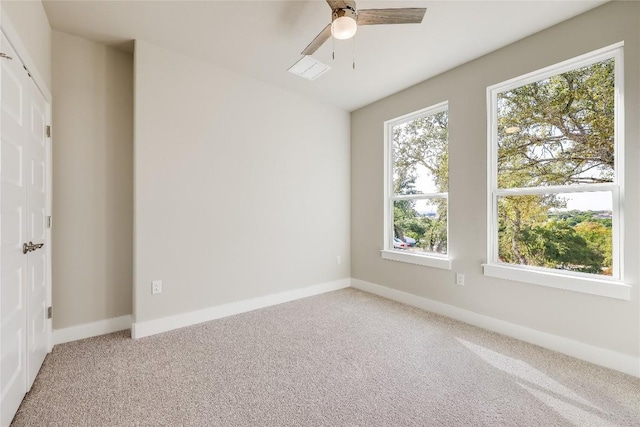 unfurnished room featuring carpet flooring and ceiling fan