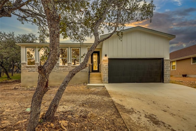 ranch-style house featuring a garage