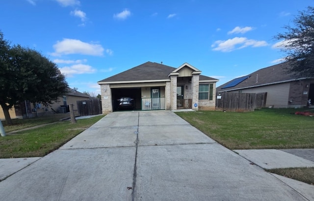 ranch-style home with a front yard and a garage