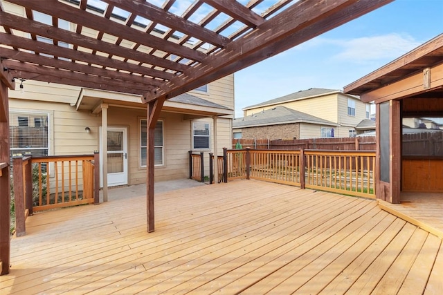 wooden terrace featuring fence and a pergola