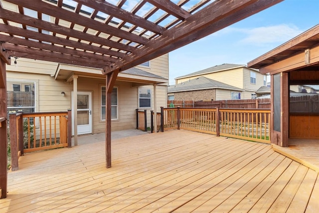 deck featuring a pergola and fence