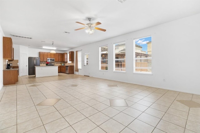 6204 Taree Loop, Killeen, TX 76549 - unfurnished living room featuring ceiling fan, light tile patterned floors, and baseboards