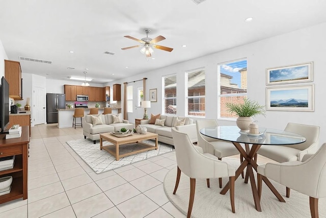 living room featuring visible vents, ceiling fan, recessed lighting, and light tile patterned flooring