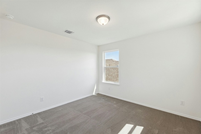 14013 Vigilance St, Manor, TX 78653 - spare room with dark carpet and a smoke detector