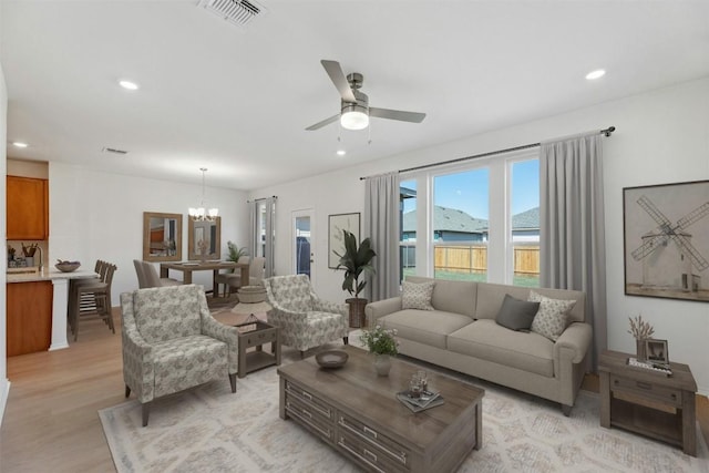 14013 Vigilance St, Manor, TX 78653 - living area featuring a chandelier, light wood-style flooring, recessed lighting, and a ceiling fan