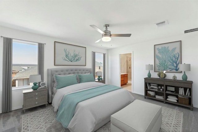 14013 Vigilance St, Manor, TX 78653 - bedroom with light carpet, ceiling fan, and ensuite bathroom