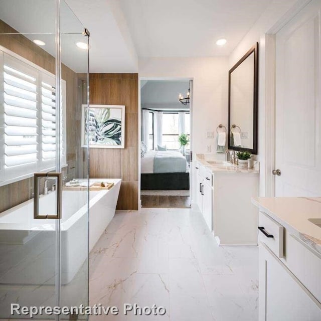 bathroom featuring wood walls, vanity, and a bath