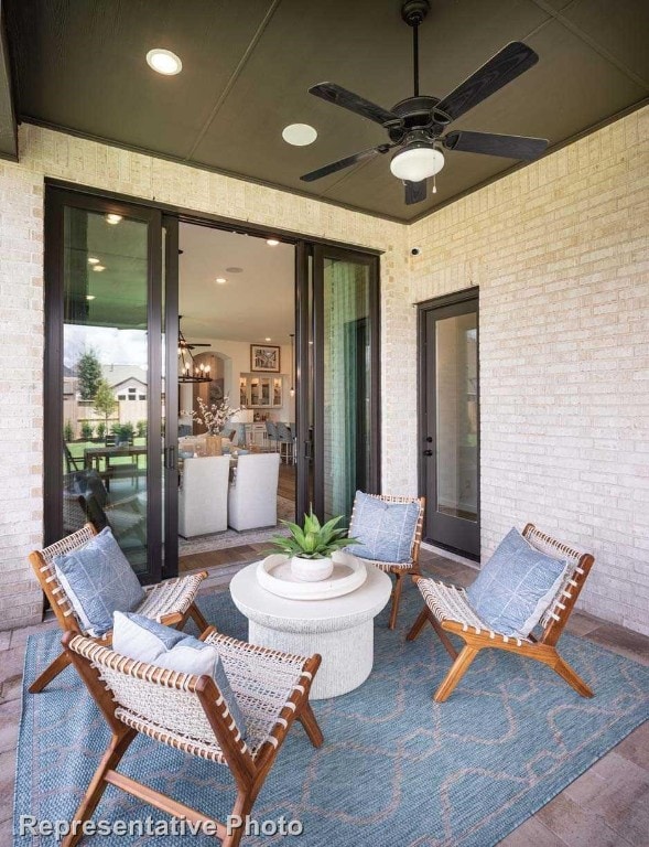 view of patio / terrace featuring ceiling fan