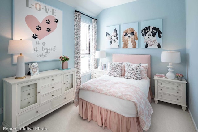 bedroom featuring light carpet and lofted ceiling