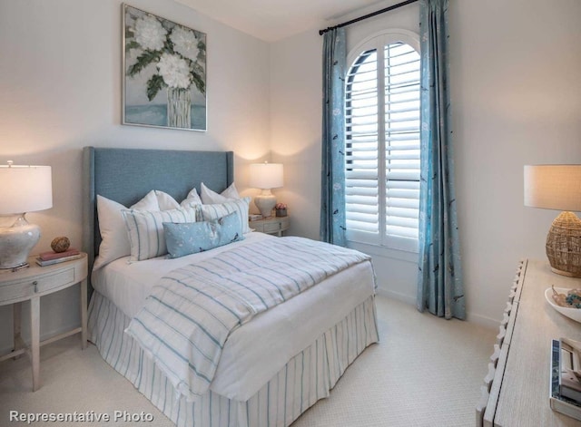 bedroom with light colored carpet