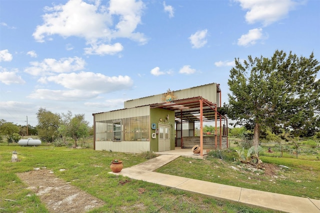 view of outbuilding with a lawn