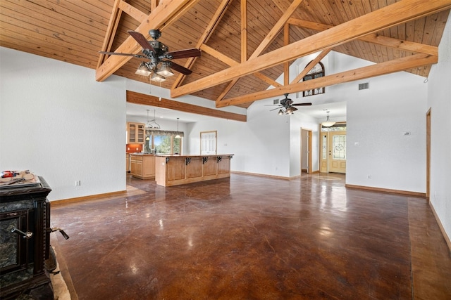 unfurnished living room featuring beam ceiling, high vaulted ceiling, and wood ceiling