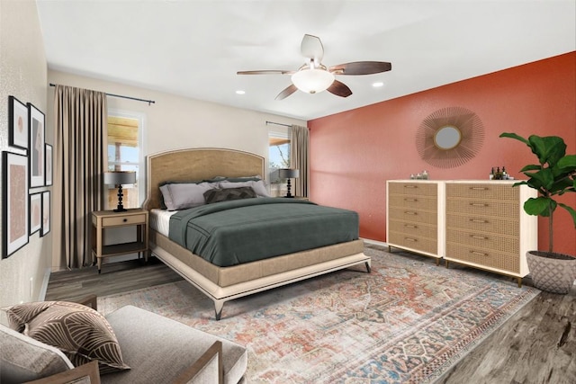 bedroom with hardwood / wood-style floors and ceiling fan