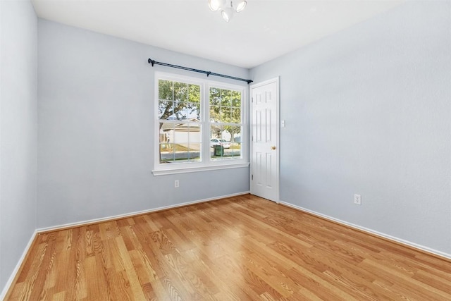 spare room featuring light hardwood / wood-style flooring