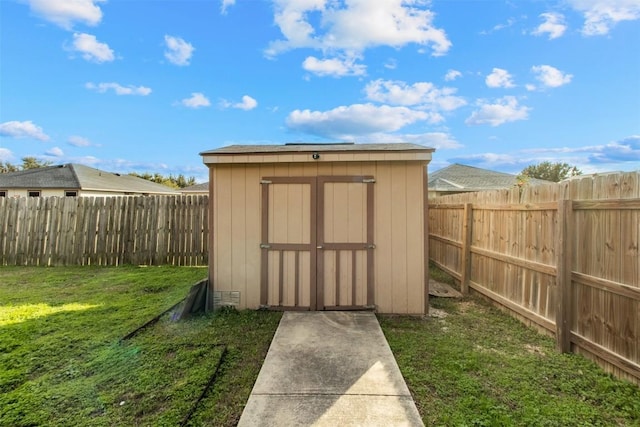 view of outbuilding with a lawn