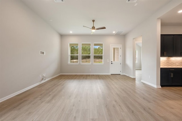 unfurnished living room with a ceiling fan, recessed lighting, baseboards, visible vents, and light wood-style floors
