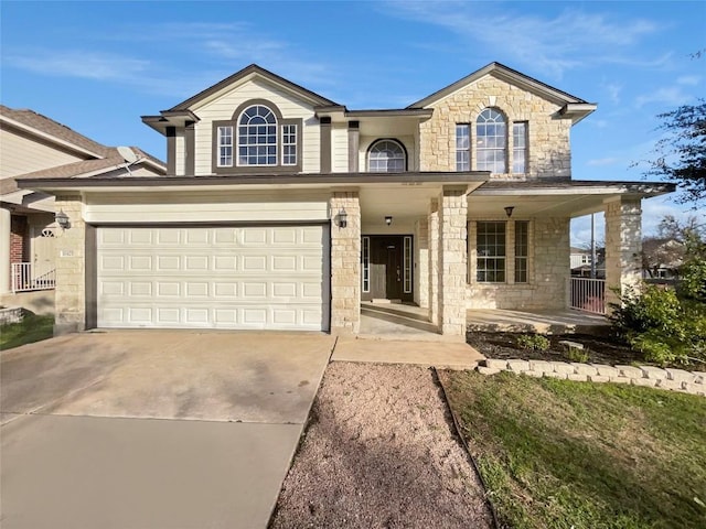 view of front of house featuring covered porch and a garage