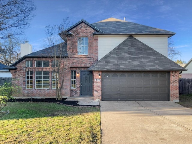 view of front property featuring a garage and a front lawn