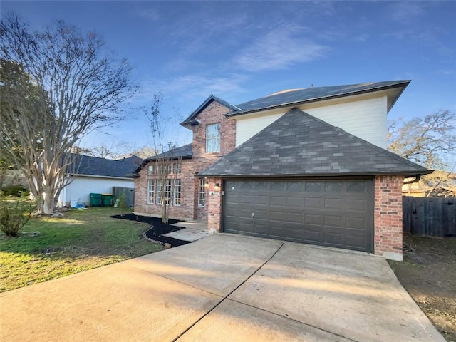 view of front of property with a front yard and a garage