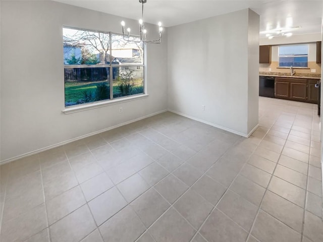 unfurnished dining area featuring sink, light tile patterned flooring, and an inviting chandelier