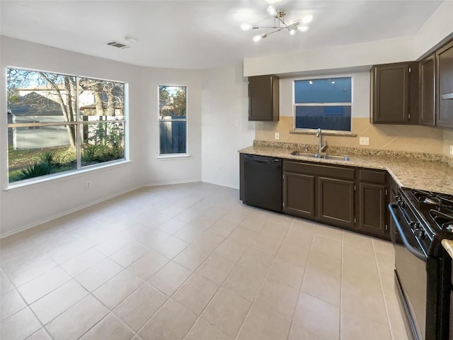 kitchen featuring dark brown cabinetry, sink, black appliances, and an inviting chandelier