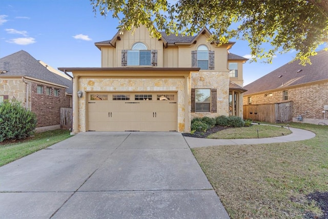 view of front property with a garage and a front yard