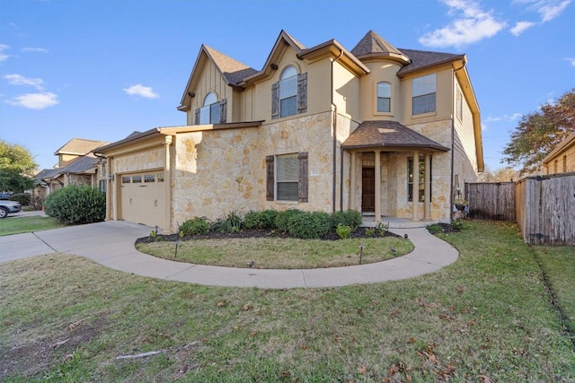 view of front facade featuring a garage and a front lawn