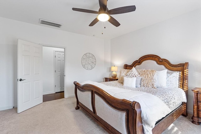 bedroom with ceiling fan and light colored carpet