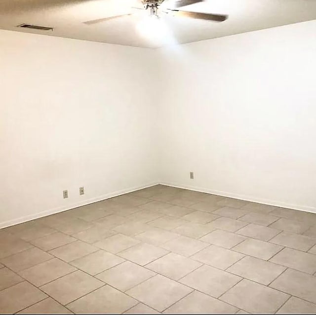 unfurnished room featuring light tile patterned floors