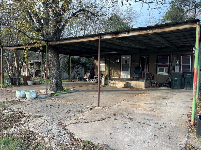 exterior space with a carport