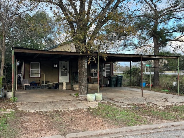 view of front of home featuring a carport