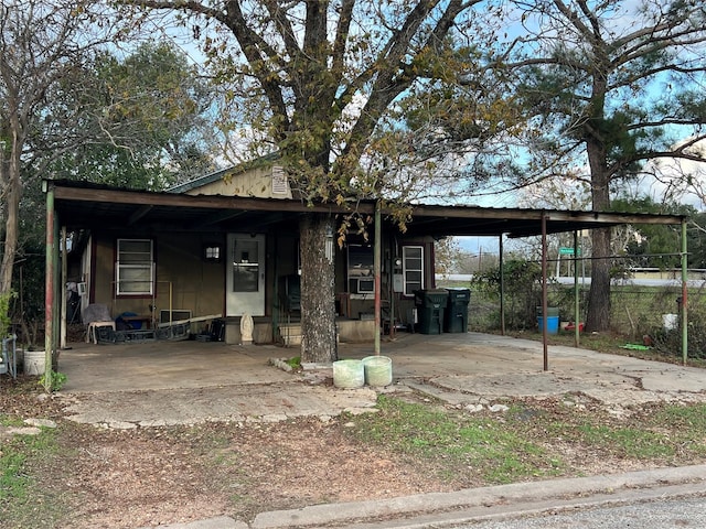 view of front of home featuring a carport