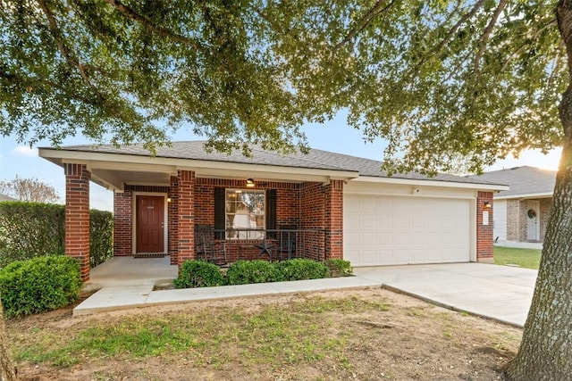 single story home featuring a porch and a garage