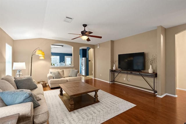 living room featuring hardwood / wood-style flooring, plenty of natural light, ceiling fan, and lofted ceiling