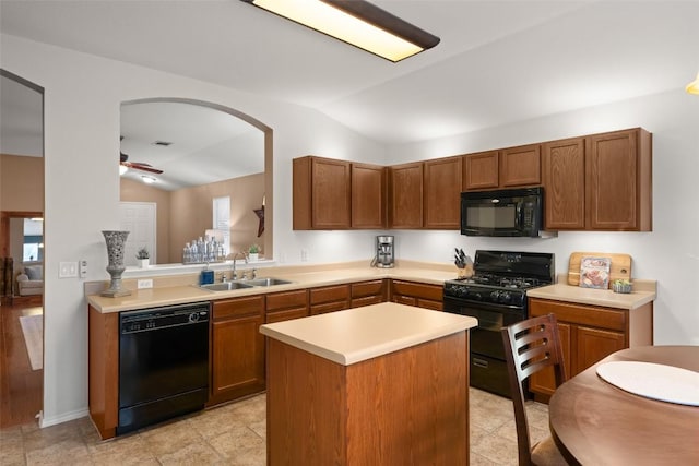 kitchen with black appliances, ceiling fan, lofted ceiling, and sink