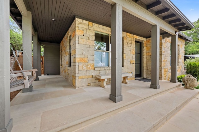 1005 Jewell St, Austin, TX 78704 - property entrance featuring covered porch and stone siding