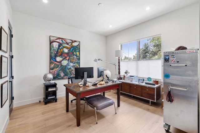 1005 Jewell St, Austin, TX 78704 - home office featuring light wood-style flooring and recessed lighting