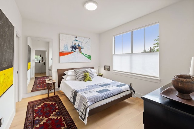 1005 Jewell St, Austin, TX 78704 - bedroom with multiple windows and wood finished floors
