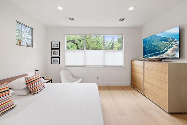 1005 Jewell St, Austin, TX 78704 - bedroom with light wood finished floors and recessed lighting