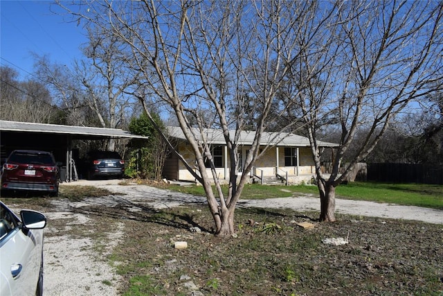 single story home with a carport