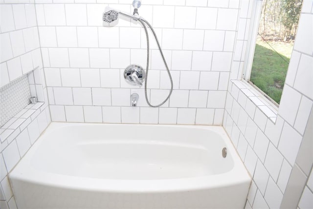 bathroom with sink and a bathtub