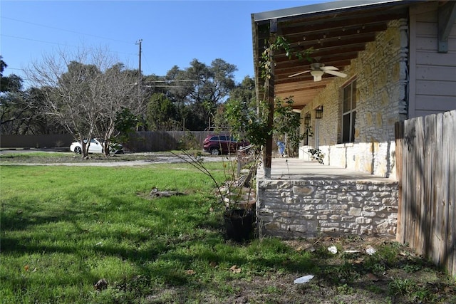 view of yard with ceiling fan