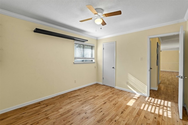 104 Thompson St, Cedar Park, TX 78613 - spare room featuring crown molding, light wood-style flooring, and a ceiling fan