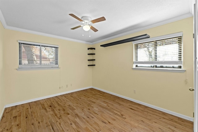 104 Thompson St, Cedar Park, TX 78613 - empty room with ornamental molding, plenty of natural light, wood finished floors, and ceiling fan