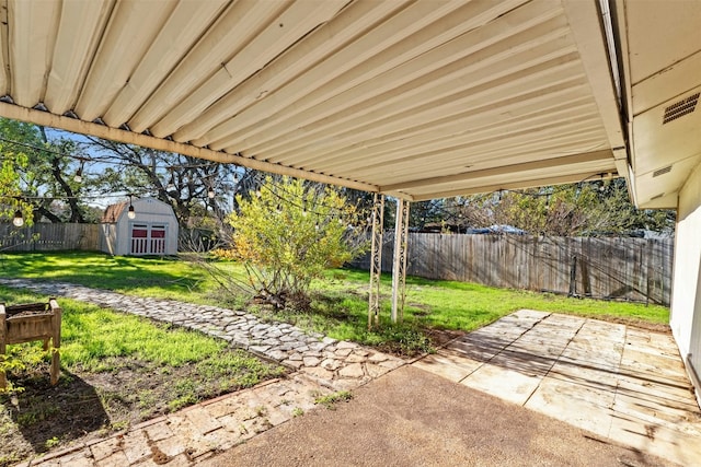 view of patio featuring a shed